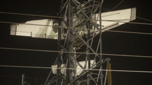 2 rescued as small plane dangles 100 feet in the air after hitting a power tower